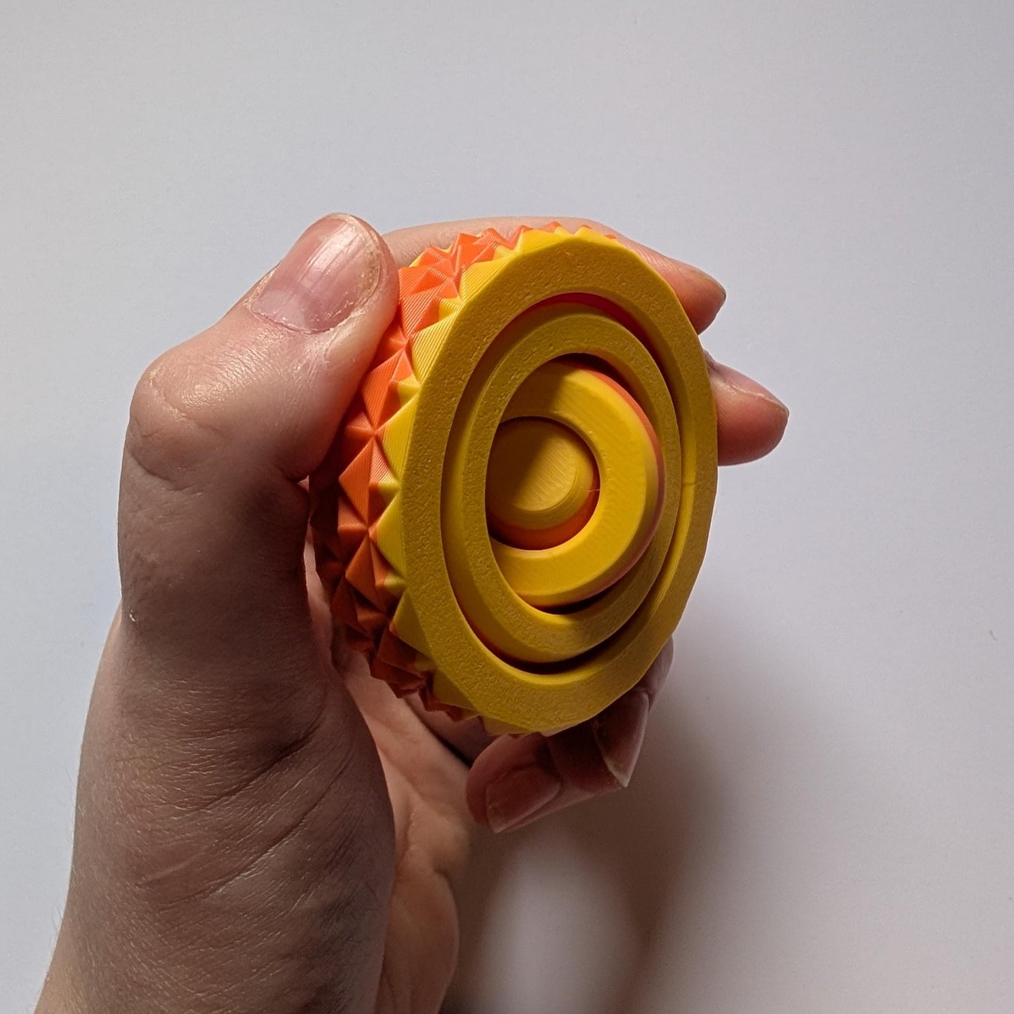 Textured Sensory Gyro fidget spinner toy.