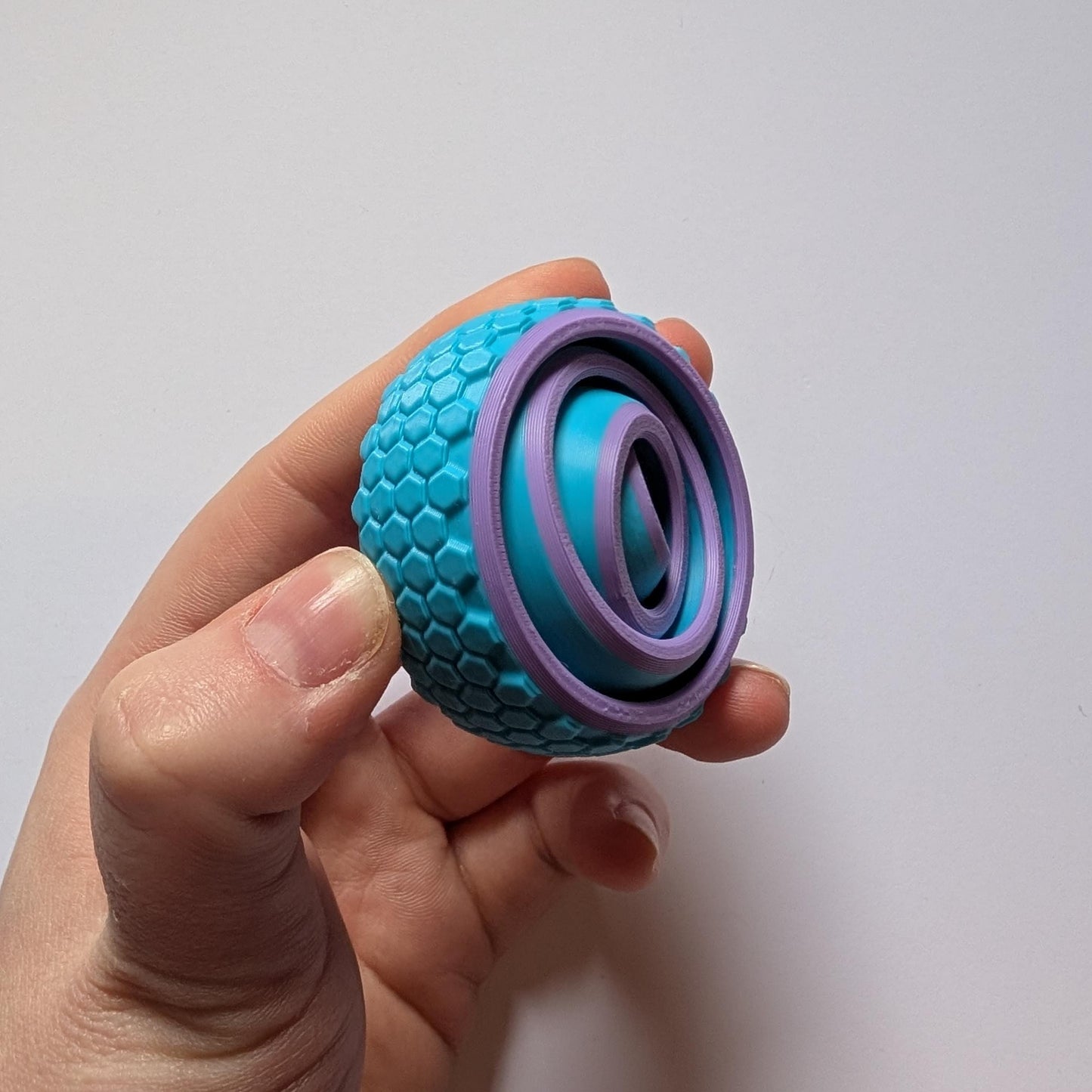 Textured Sensory Gyro fidget spinner toy.