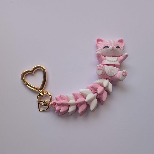 Pink and white flexi cat/fox fidget keyring!