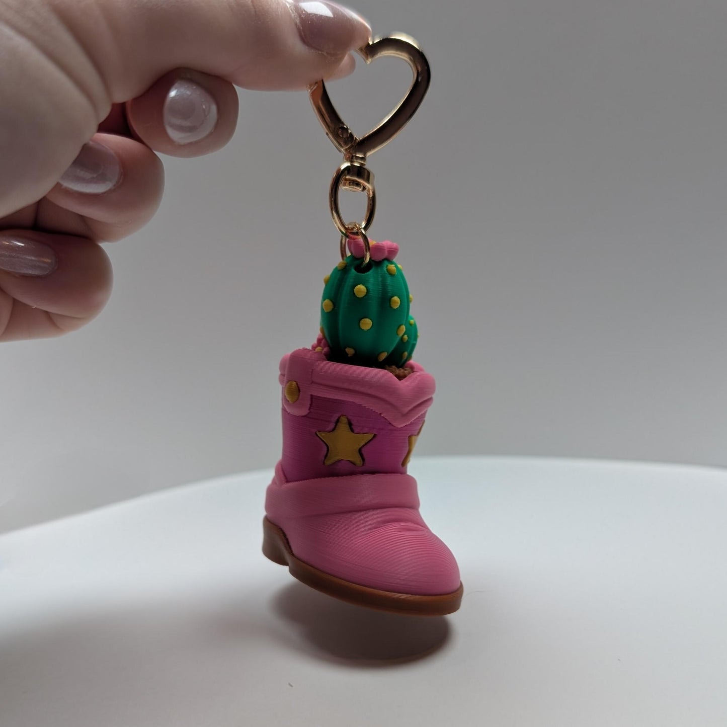 Cute pink cowboy boot fidget clicker keyring with cactus plant heart shaped keyring
