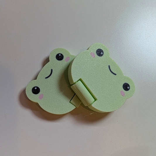 Frog coin flipper
